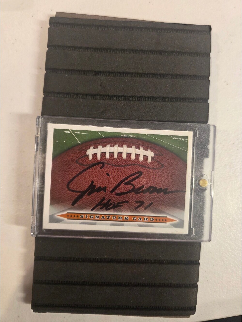 Jim brown auto card with hall of fame inscription and coa sticker